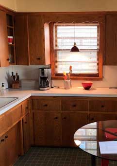 Before remodel image of outdated kitchen